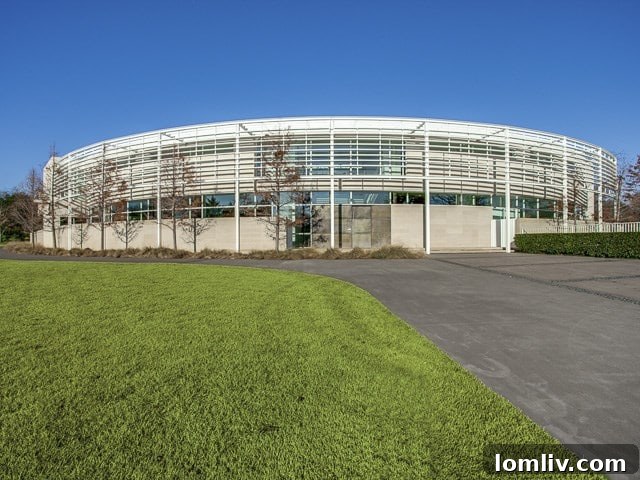 An exquisite modern home exterior at 6645 Northaven, featuring clean lines and expansive windows amidst lush landscaping.