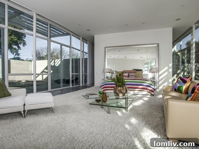 The luxurious master bedroom, designed for comfort and tranquility with ample natural light.