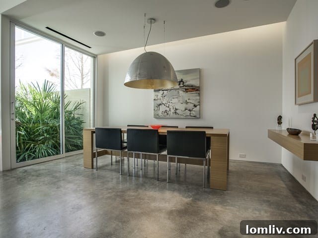 A bright breakfast nook with minimalist design, offering views of the outdoors.