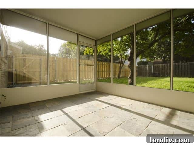 Inviting Screened Porch Perfect for Outdoor Dining at 9937 Larchbrook