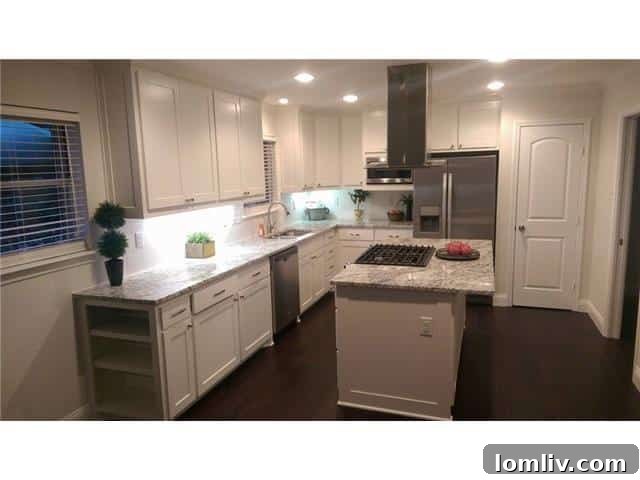 Stunning Lake Highlands Remodel Showcases a Custom Kitchen 7 Updated Kitchen with Stainless Steel Appliances and Eat-in Island