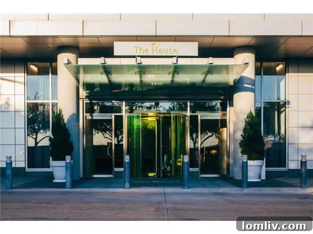 The House Exterior - A sleek, contemporary high-rise in Dallas's Victory Park, showcasing modern architecture and urban elegance.