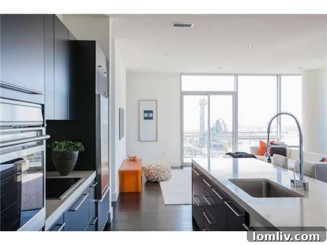 The House Kitchen - A spacious, modern kitchen with high-end appliances, marble countertops, and ample space for entertaining.