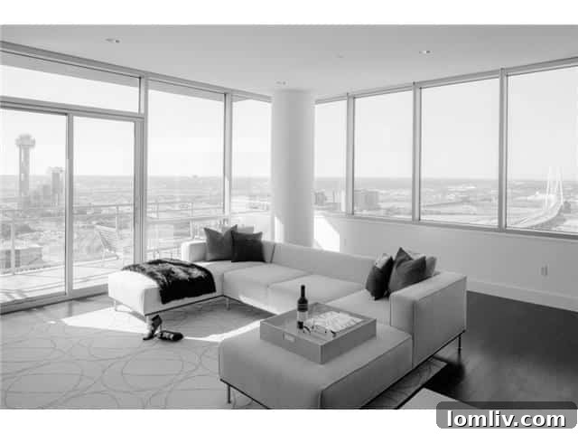 The House Living Room - A bright and inviting living space with elegant furnishings and stunning city views.