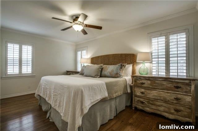 Midcentury Marvel: East Dallas Ranchette's Compact Power 14 Master bedroom with hardwood floors and plantation shutters