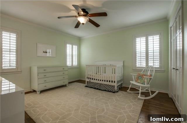 Midcentury Marvel: East Dallas Ranchette's Compact Power 15 Second bedroom with ceiling fan and crown molding
