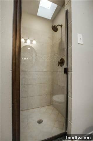 Midcentury Marvel: East Dallas Ranchette's Compact Power 17 Second renovated bathroom with stylish tile and vanity