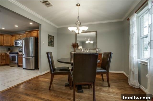 Midcentury Marvel: East Dallas Ranchette's Compact Power 8 View of the kitchen from the living area