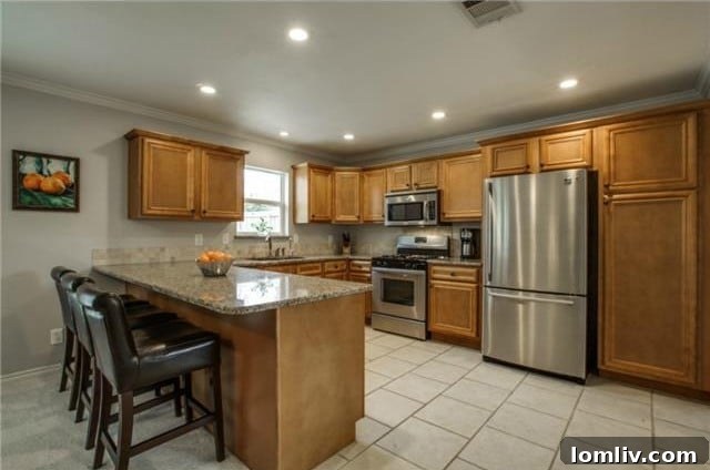 Midcentury Marvel: East Dallas Ranchette's Compact Power 9 Detail of kitchen appliances and cabinetry