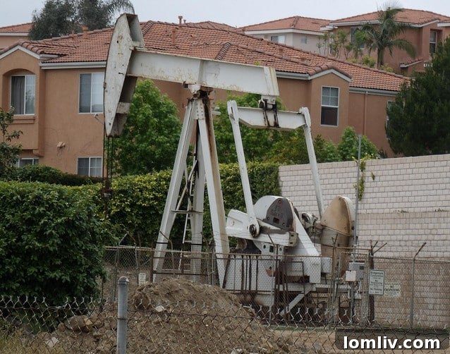 Oil derricks against a Texas landscape, symbolizing the state's energy economy and its connection to housing markets