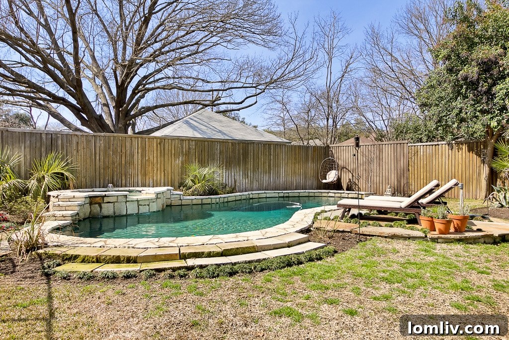 The sparkling backyard pool, ready for relaxation and entertaining.