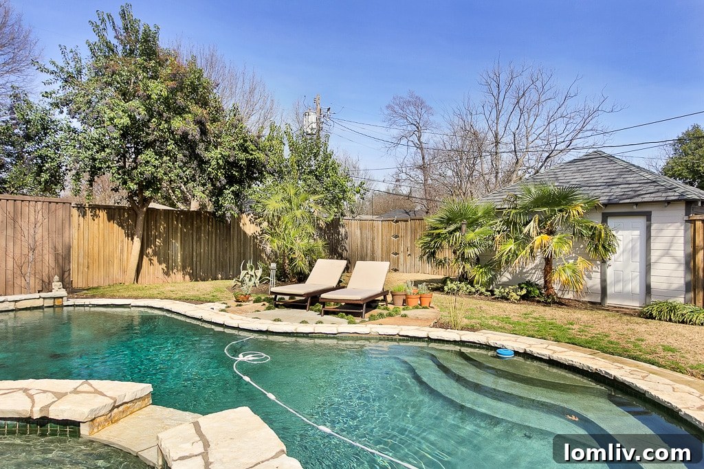 Charming East Dallas Tudor Gem Won't Last Long 19 The charming exterior of 6917 Casa Loma Avenue at dusk, highlighting its welcoming ambiance.