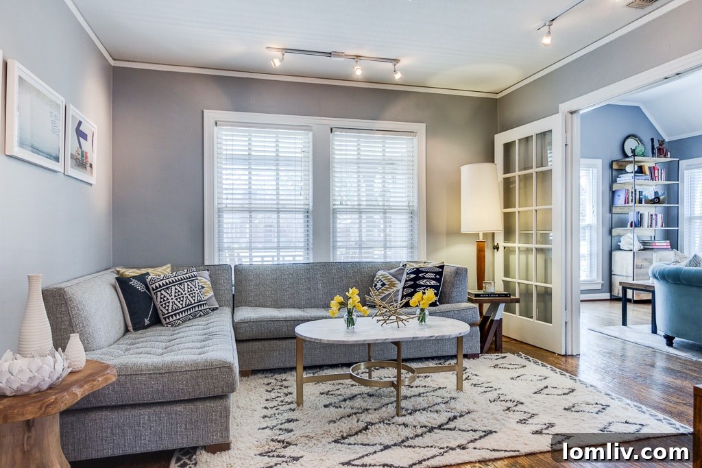 Charming East Dallas Tudor Gem Won't Last Long 6 A cozy bedroom in the Casa Loma Avenue home, featuring ample natural light and neutral decor.