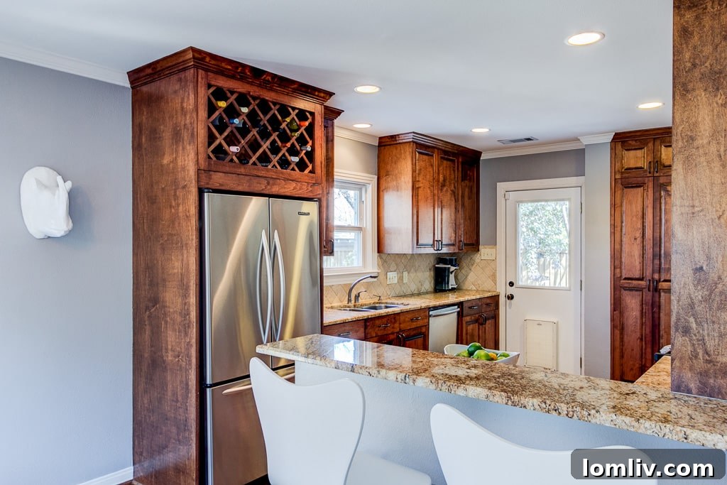 Charming East Dallas Tudor Gem Won't Last Long 10 A charming and functional kitchen with direct access to another living space.