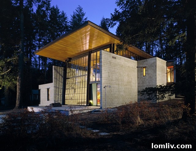 Chicken Point Cabin, a modern lakeside retreat by Tom Kundig, Olson Kundig Architects, featuring a large operable wall