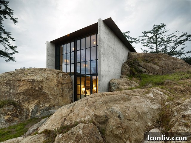 Exterior of The Pierre Residence, a unique home by Tom Kundig integrated into a rock outcropping