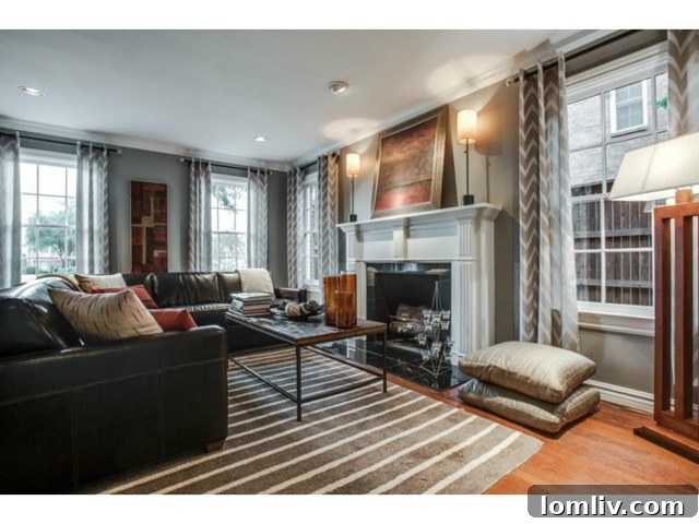 Spacious living room with fireplace and ample natural light