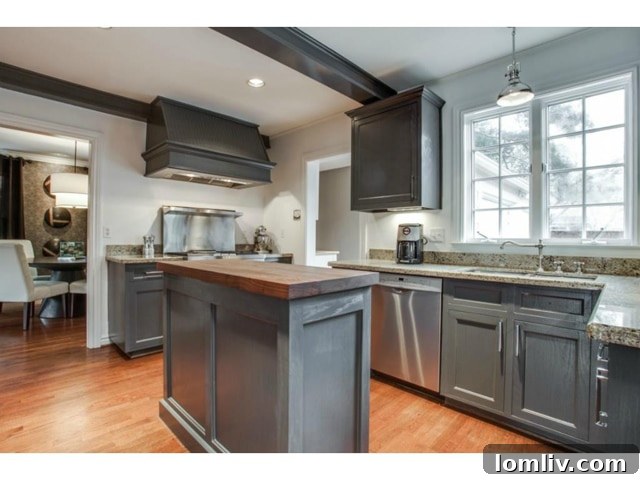 Modern kitchen with stainless steel appliances and abundant cabinetry