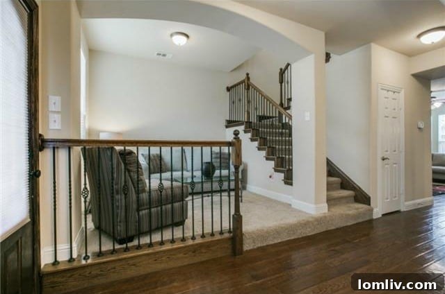 6822 Oeste Dr. Staircase with Iron Railings
