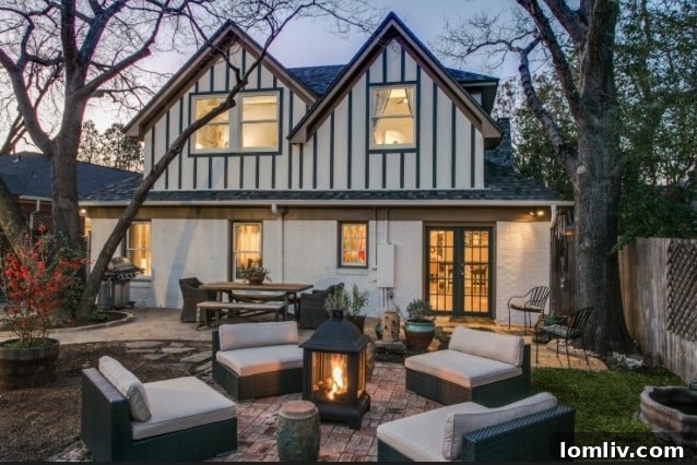 The beautifully landscaped backyard of Stacey Warnix's Hollywood Heights Tudor, offering a serene outdoor retreat that complements the home's historic charm and modern living.