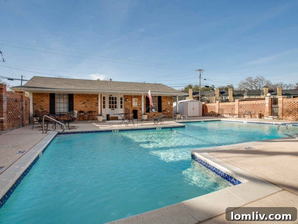 Exterior shot of Sandhurst Manor condo, highlighting landscaped grounds and swimming pool