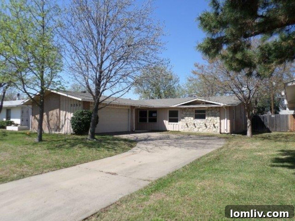 Charming exterior of a Northwest Dallas home at 3253 High Lark Dr with mature trees