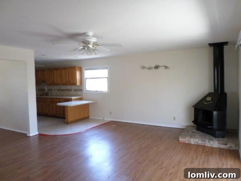 Interior view of the living area with a unique wood-burning fireplace in a Dallas fixer-upper