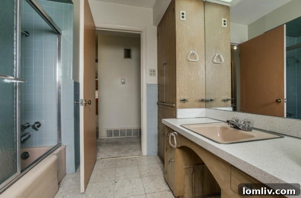 Master bathroom with original tile and unique pegboard vanity