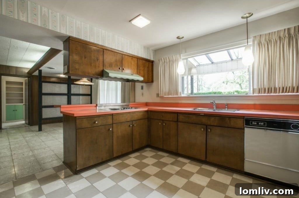 Kitchen view with coral laminate countertops and mint-green oven