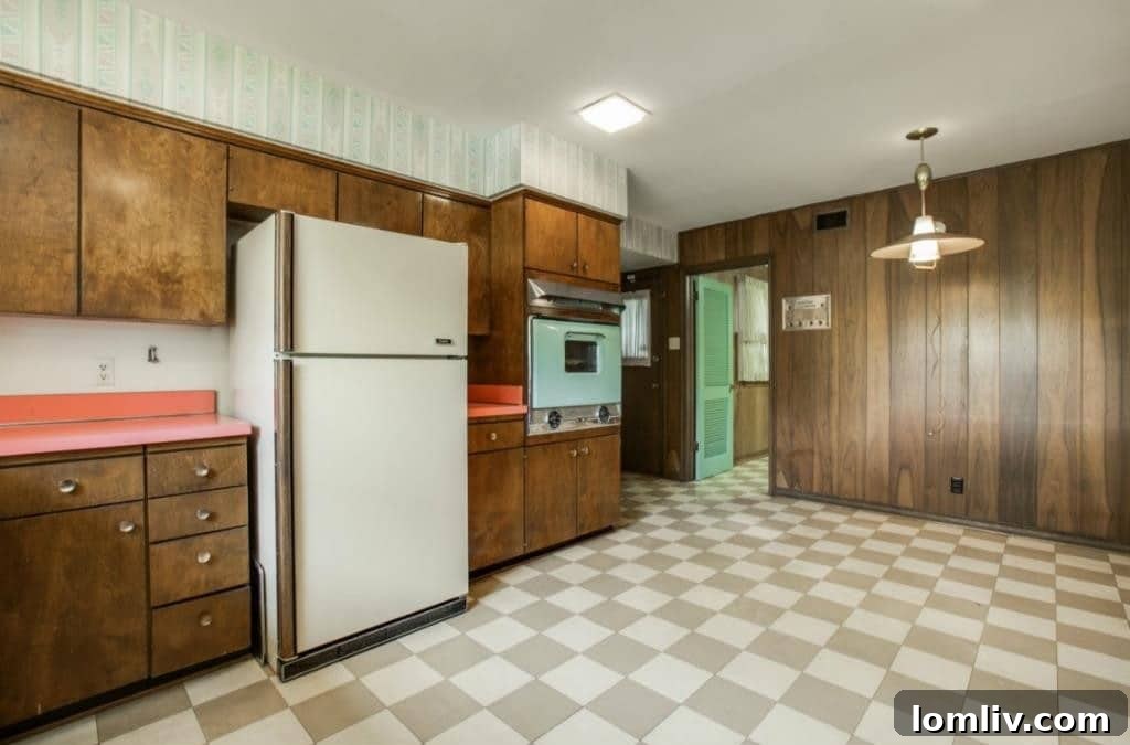 Another angle of the preserved retro kitchen with checkerboard floor