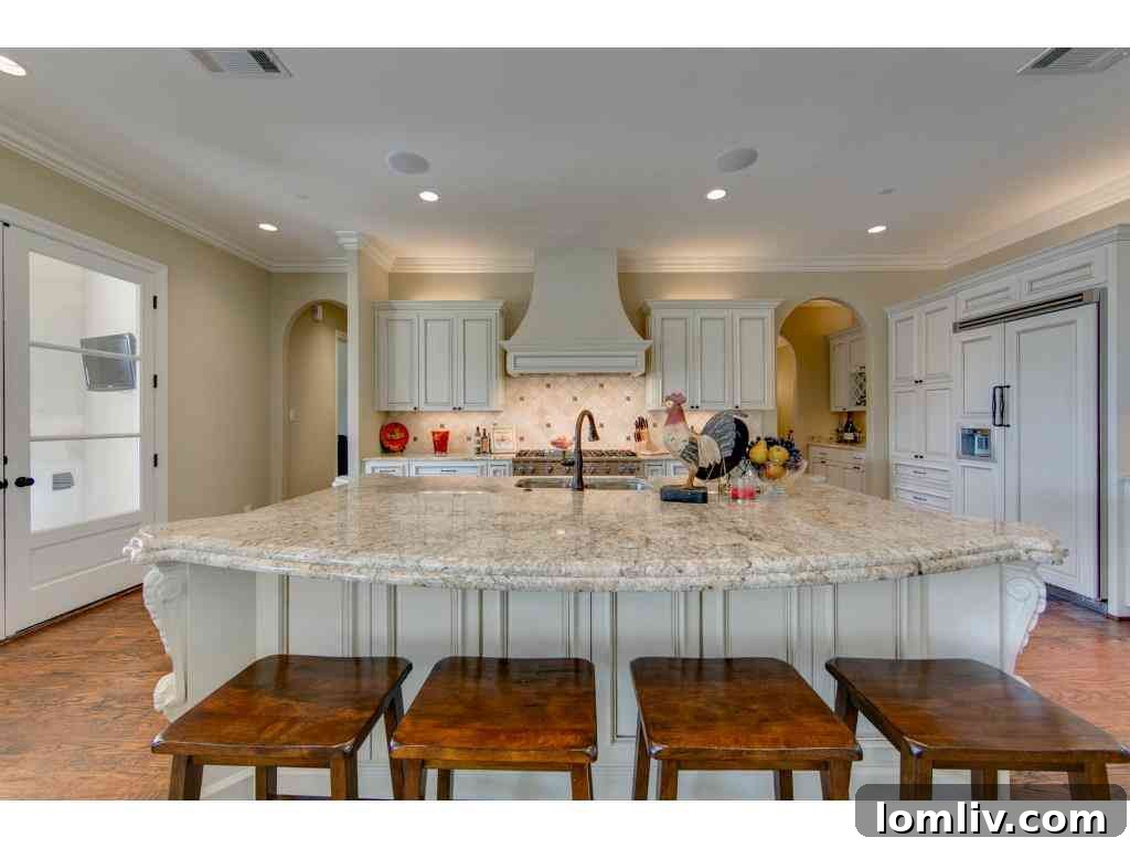 Spacious master bathroom with luxurious finishes, a freestanding soaking tub, and separate shower, 415 Blondy Jhune Road.