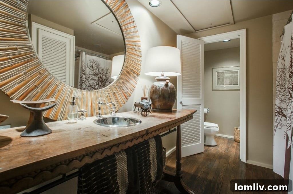 Full Bathroom Accessible from Second Bedroom with Unique Mirror