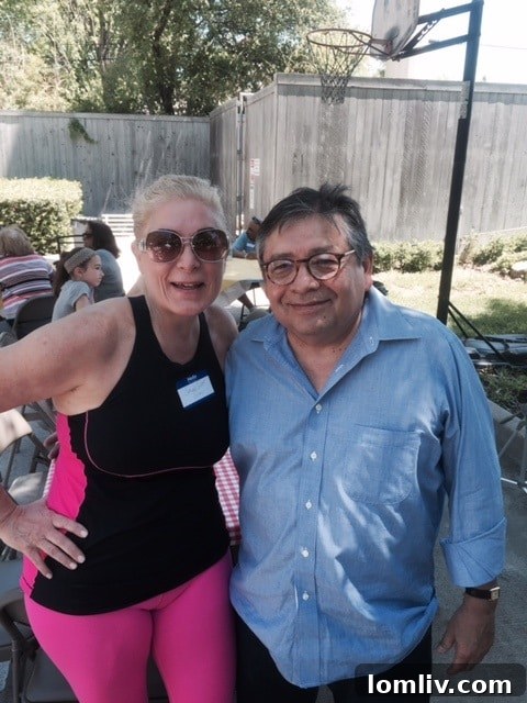 Marcos Ronquillo engaging with community members over BBQ in Oak Cliff