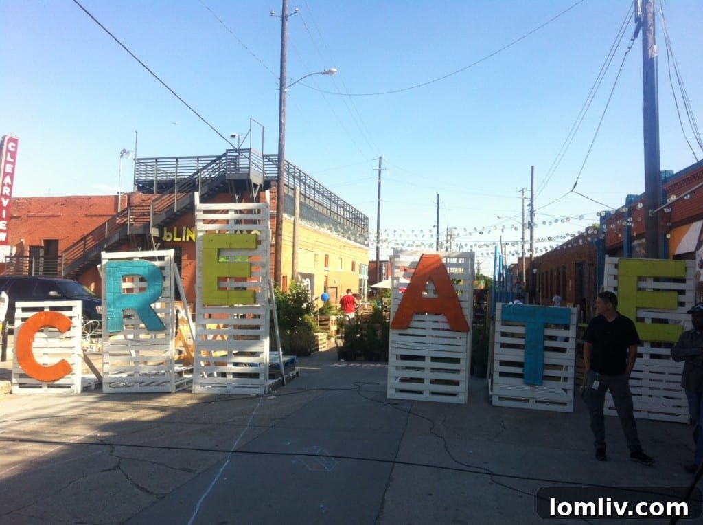 Creative Gateway into Crowdus Park from Elm St in Deep Ellum, showing temporary urban design elements