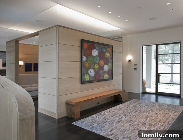 Spacious modern living area featuring high ceilings, contemporary furniture, and abundant natural light from large windows