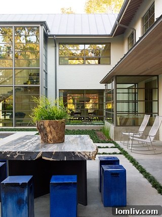 Spacious and inviting outdoor living area featuring comfortable seating, lush greenery, and a tranquil ambiance