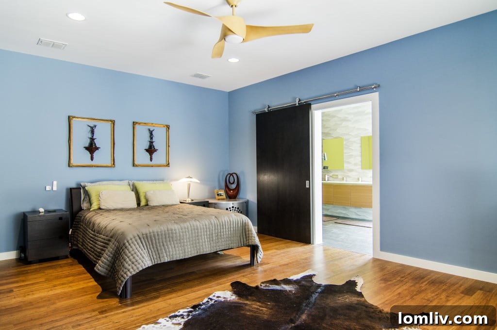 Elegant master bedroom with sophisticated decor and ample natural light