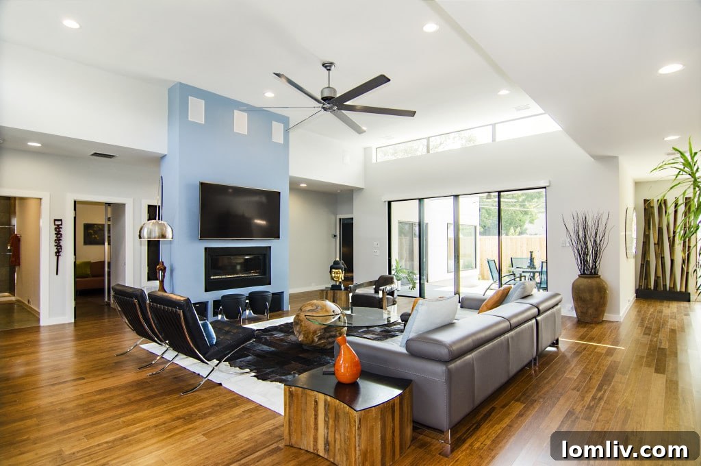 Bright and airy living room with large windows in the Adrian Drive home