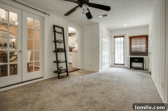 Carpeted second living room leading to bedrooms
