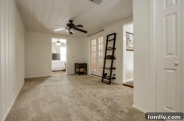 Second living room showing access to covered patio