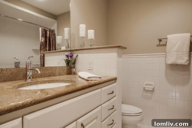 Another view of a secondary bedroom, well-lit and comfortable