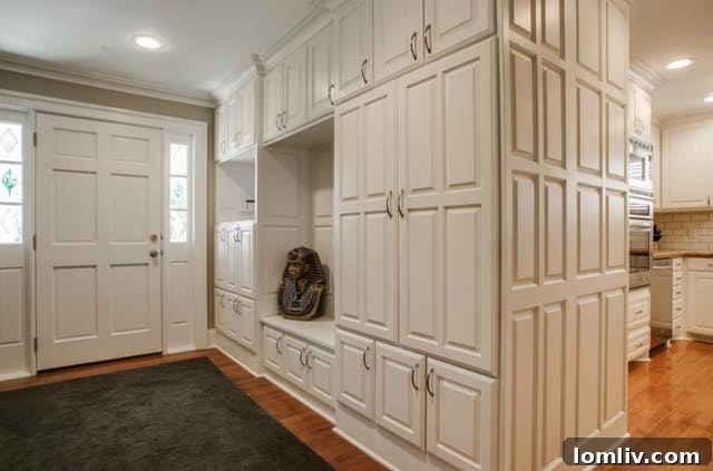 Entryway with floor-to-ceiling storage cabinets at 9911 Estate Ln