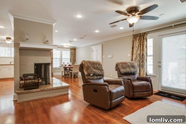 Open concept living area with hardwood floors and natural light
