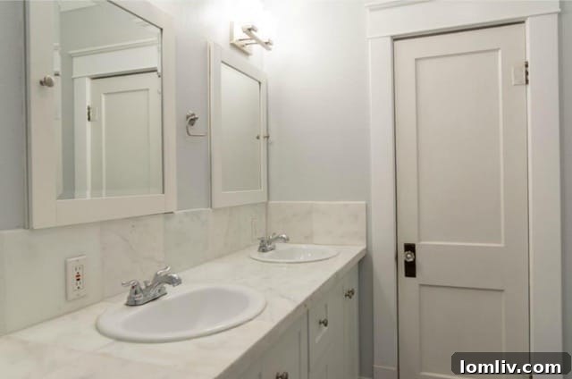 Master bathroom with marble counters and ample space