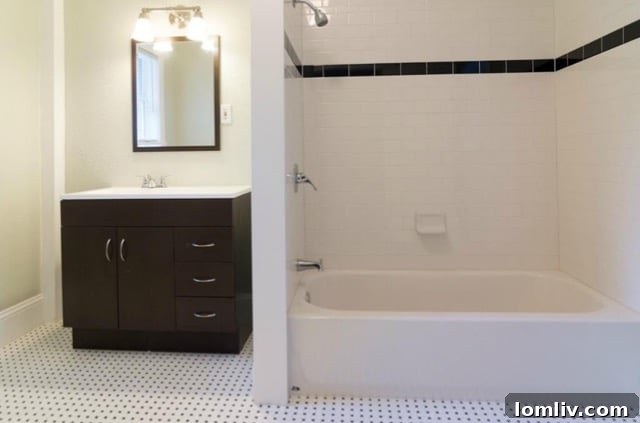 Renovated second bathroom with basket-weave tile