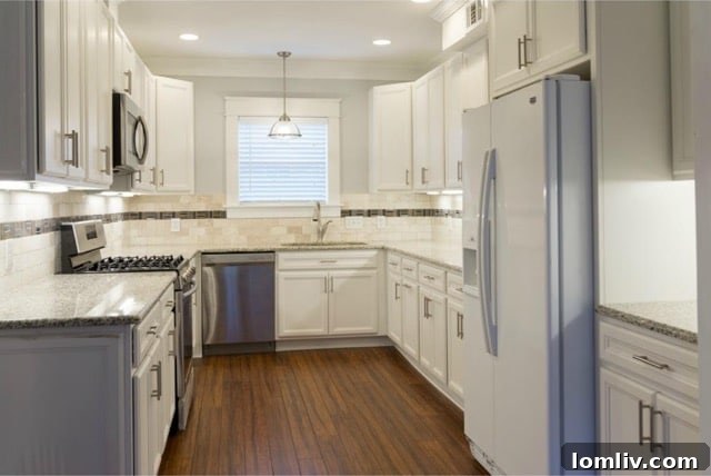 Updated kitchen with granite counters and stainless steel appliances