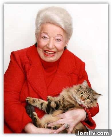 Ebby Halliday's cat Lucy, a beautiful long-haired tortoiseshell, happily reunited with her family.