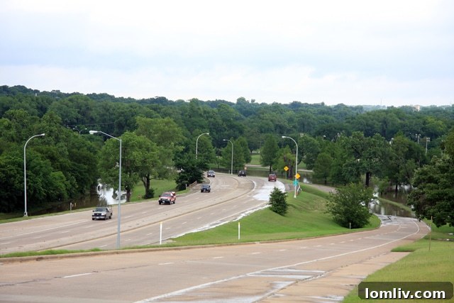 Police tape blocking flooded access roads from White Rock Lake to Buckner Boulevard
