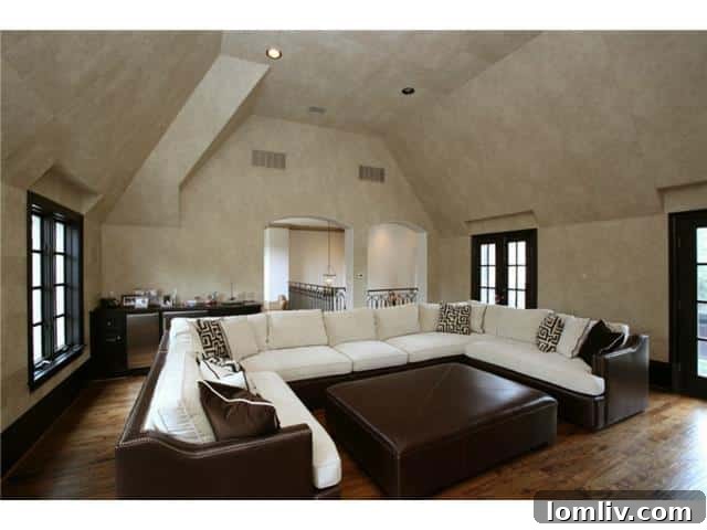 Troy Aikman's Normandy Home Under New Ownership 17 Vibrant game room, offering a dedicated space for entertainment and leisure activities.