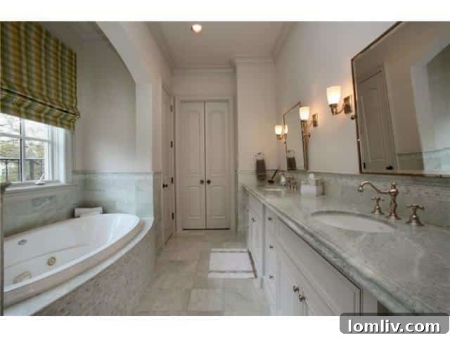 Troy Aikman's Normandy Home Under New Ownership 20 Well-appointed child's bathroom, featuring modern fixtures and bright design.